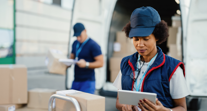 a lady nect to a logistic truck